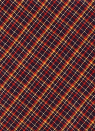 Brightly colored red yellow and black diagonal plaid fabric background 