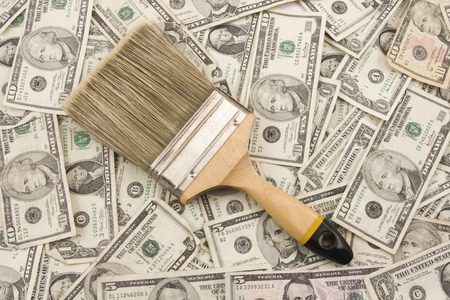 Paintbrush on background of American currency の写真素材