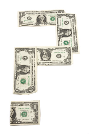 Question mark made from dollar bills on white background の写真素材