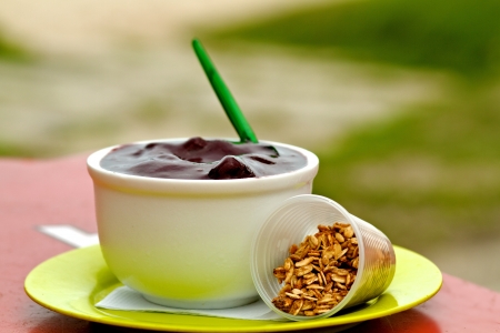 The Brazilian fruit, açai is commonly served as a thick sweet jelly topped with granola and or bananas. Mashed and frozen in a bowl, it is known as の写真素材