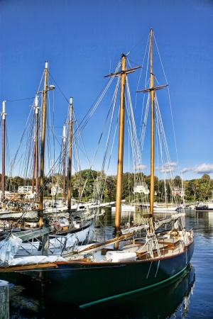 Sailing ships docked in a Maine harborの写真素材