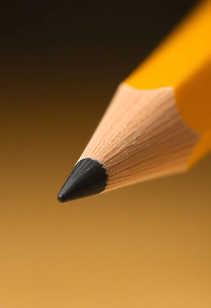 close up of a pencil with a brown backgroundの素材