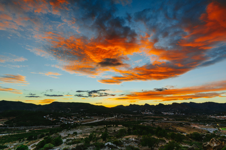 View on the castle Sagunto during sunny day and cloudy sunsetの写真素材