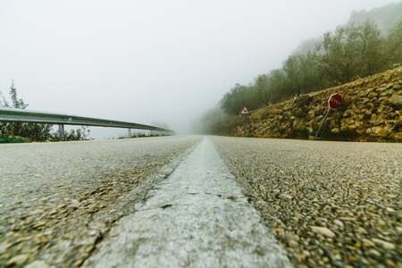 Mystical views of the road in dense fog in the mountains of the Iberian Peninsulaの写真素材