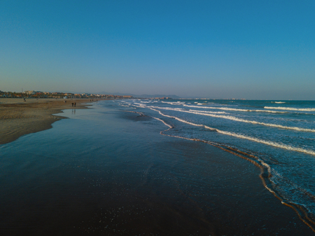 Views from drone during sunset on beach Malvarrosa in Valenciaの写真素材