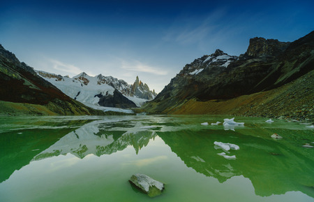 View of the peaks of the mountain of Cerro Torro and the lake in the national park of Los Glaciares during sunset. The autumn in Patagonia, the Argentine sideの写真素材