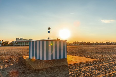The sunset clock on the beach of Malvarros on a clear day. Valencia, Spainの写真素材