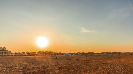 The sunset clock on the beach of Malvarros on a clear day. Valencia, Spainの写真素材