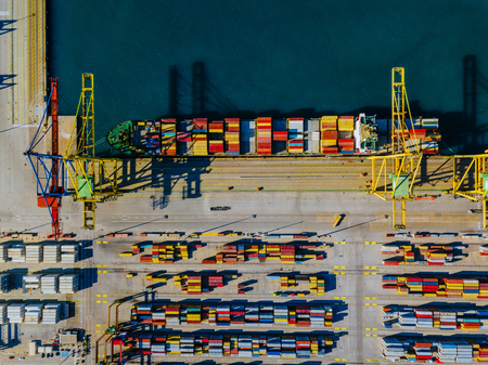 Aerial view of the commercial port of Valencia. Container terminal and ship during loading.