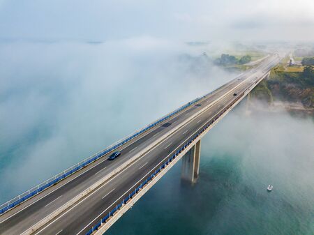 Aerial view on dos Santos bridge during fog and bay. Near Ribadeo in Northern Spain.の写真素材