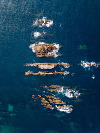 Aerial view of the coastline and cliffs during sunset on the beach of Quintana and Estaca. Northern Spain in summer.の写真素材