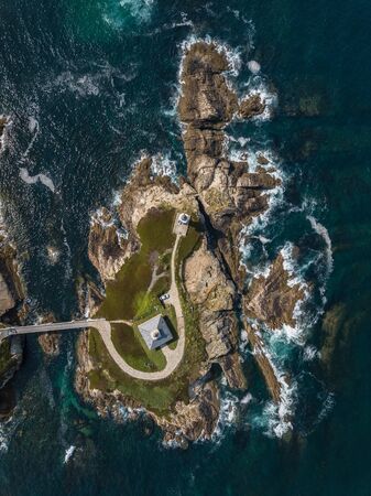 Aerial view of the lighthouse on Pancha island. Northern Spain in summer.の写真素材