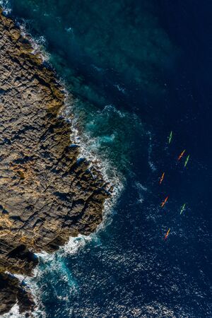 Aerial view of people canoeing around the island of Ibiza.の写真素材