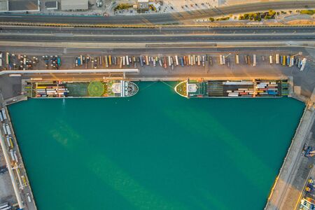 Aerial view of the container terminal of the seaport of the city of Valencia and the ship during loading.の写真素材