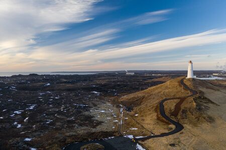 Aerial view of the lighthouse at Reykjanes Peninsula during sunset. Iceland in early springの写真素材