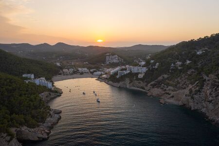 Aerial view of the coastline of Ibiza island during sunset.の写真素材