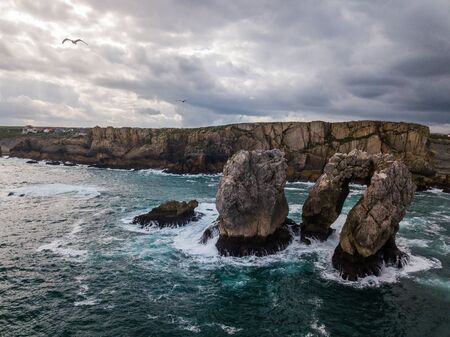 Aerial view of reefs and cliffs after dawn on Arnia Beach. Northern Spain in summer.の写真素材