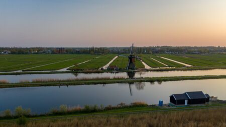Aerial view of windmills in the Kinderdijk area during sunset. Spring in Hollandの写真素材