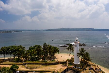 Aerial view of a mosque and a lighthouse in the Galle area on Sri Lankaの写真素材