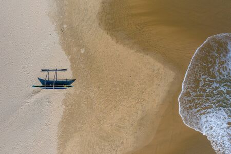 Aerial view of fishing catamars on a beach in the south of Sri Lankaの写真素材