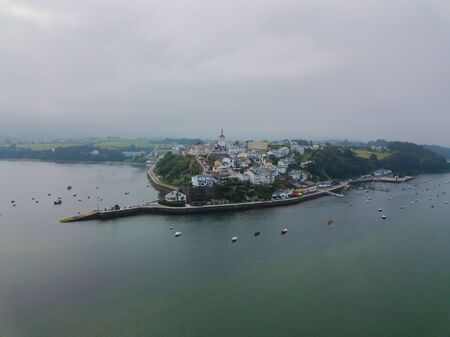 Aerial view of the city of Castropol and the bay during fog. Northern Spain in summer
