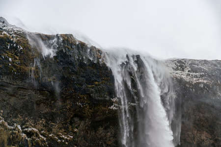 Icelandic waterfall Seljalandsfoss durind winter timeの写真素材