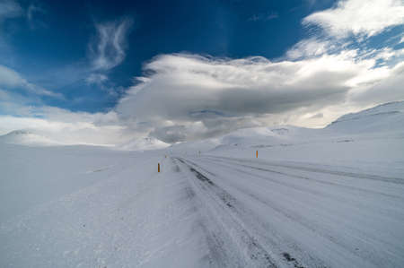 Beautiful and dangerous driving road in winter snow Icelandの写真素材