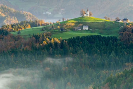 The Church of St. Tomaz (St. Thomas) on top of a hill at a beautiful sunrise in the fall, near...