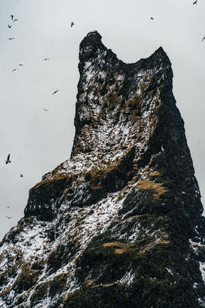 Basalt rock formations Troll toes on black beach. at storm Reynisdrangar, Vik, Icelandの写真素材