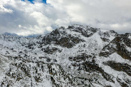 Aerial view of the valley and mountains after the first snow near the village of La Mongie. Pyrenees...