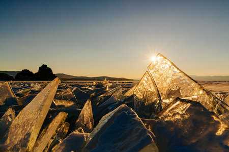 View on and throug ice during sunset on Lake Baikal. Russia, Siberiaの写真素材