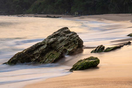 Wave and splashes on beach in Sri Lanka, near Matara.の写真素材