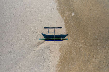 Aerial view of fishing catamars on a beach in the south of Sri Lankaの写真素材