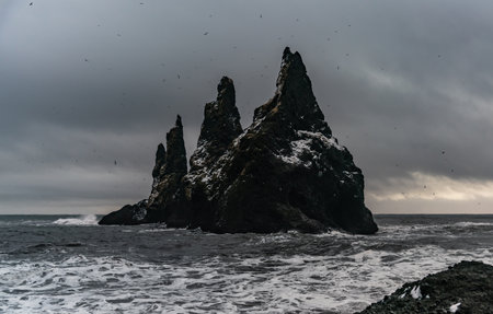 Basalt rock formations Troll toes on black beach. at storm Reynisdrangar, Vik, Icelandの写真素材
