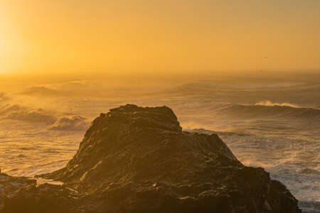 View from cape Dyrholaey, Iceland. Stormy sunriseの写真素材