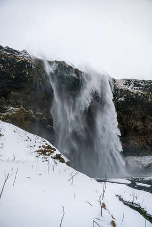 Icelandic waterfall Seljalandsfoss durind winter timeの写真素材