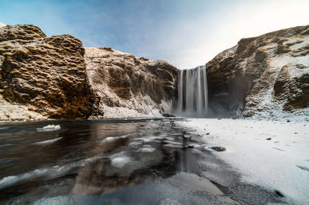 The famous Skogafoss waterfall in the winter at sunrise. One of the most popular places in Icelandの写真素材