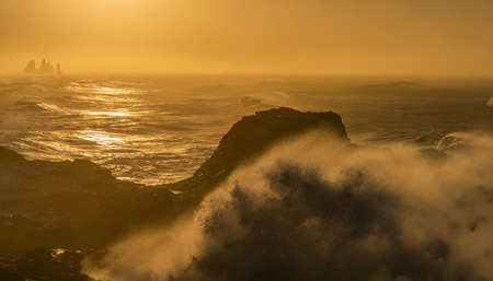 View from cape Dyrholaey, Iceland. Stormy sunriseの写真素材