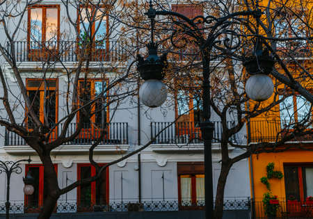 Old urban buildings during the sunset and just beginning spring in Valencia during the Fallas 2018 festivitiesの写真素材