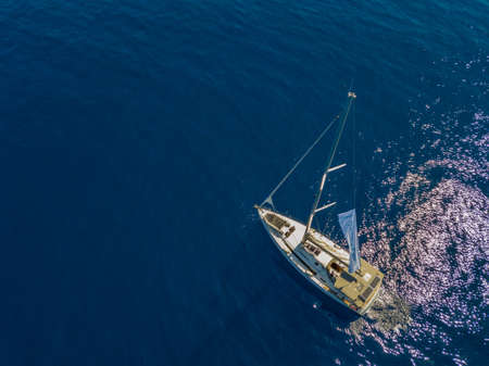 Aerial view of a sailing yacht near the Greek islandsの写真素材