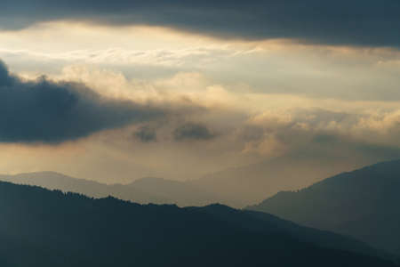 View of a mountain range in the Alps of Europe during sunset. Slopes in Autumnの写真素材