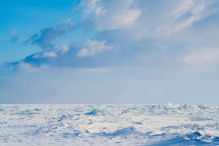 View on and through ice on frozen fields of Lake Baikalの写真素材