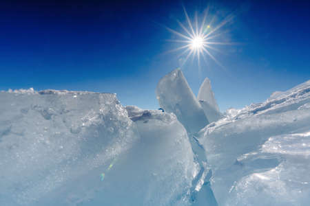 View on and through ice on frozen fields of Lake Baikalの写真素材