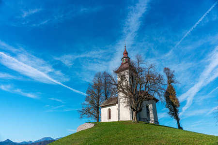 The Church of St. Thomas is one of the most famous tourist attractions. It is located near Lake Bled and Ljubljana. The sky is very colorful before sunset.の写真素材