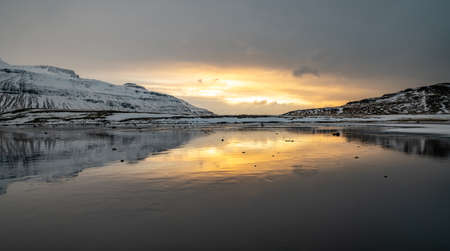 Sunset and reflections on the beautiful Kirkjufell mountain, Snaefellsness peninsula, Icelandの写真素材