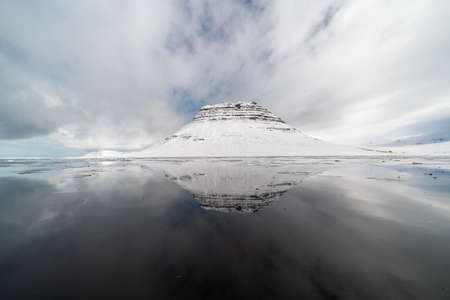 Sunset and reflections on the beautiful Kirkjufell mountain, Snaefellsness peninsula, Icelandの写真素材