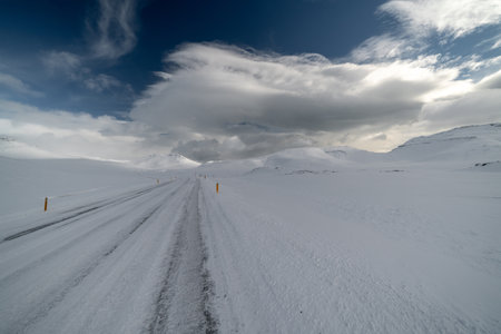 Beautiful and dangerous driving road in winter snow Icelandの写真素材