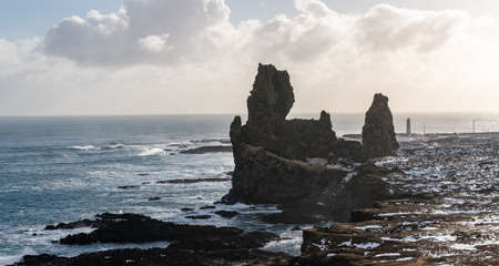 Londrangar in Snaefellsnes National Park, Iceland. Londrangar and hill Svalthufa are remains of a...