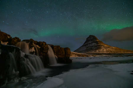 Northern Light, Aurora borealis at Kirkjufell in Iceland. Kirkjufell mountains in winterの写真素材