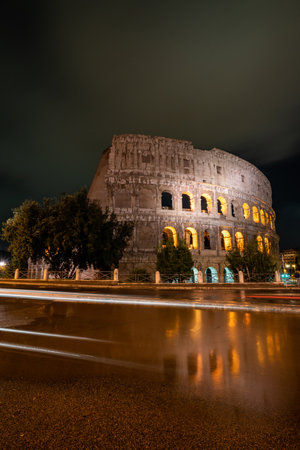 Illuminated Coliseum at Night in Rome, Italyの写真素材